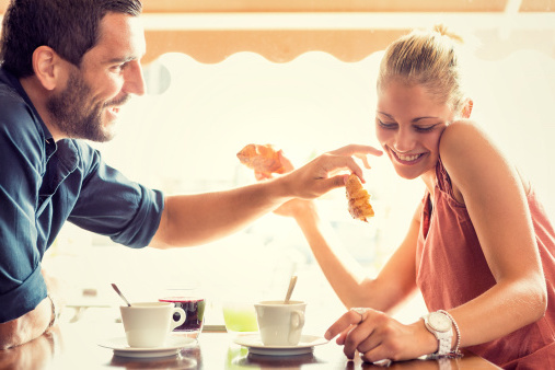 Young couple has breakfast at italian caf√É¬©